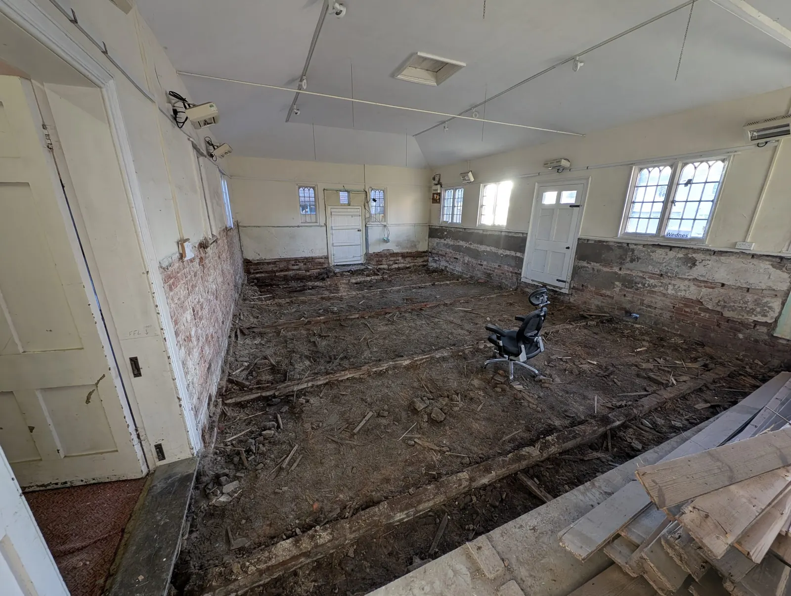 The hall with its old floor removed, ready for the new foundations